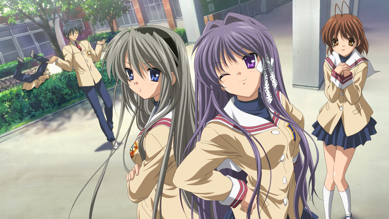 Two girls are posing in the front of the picture with a timid girl to the right and a boy to the left who is shrugging. There is also a boy face down in the bushes in the very back of the picture.